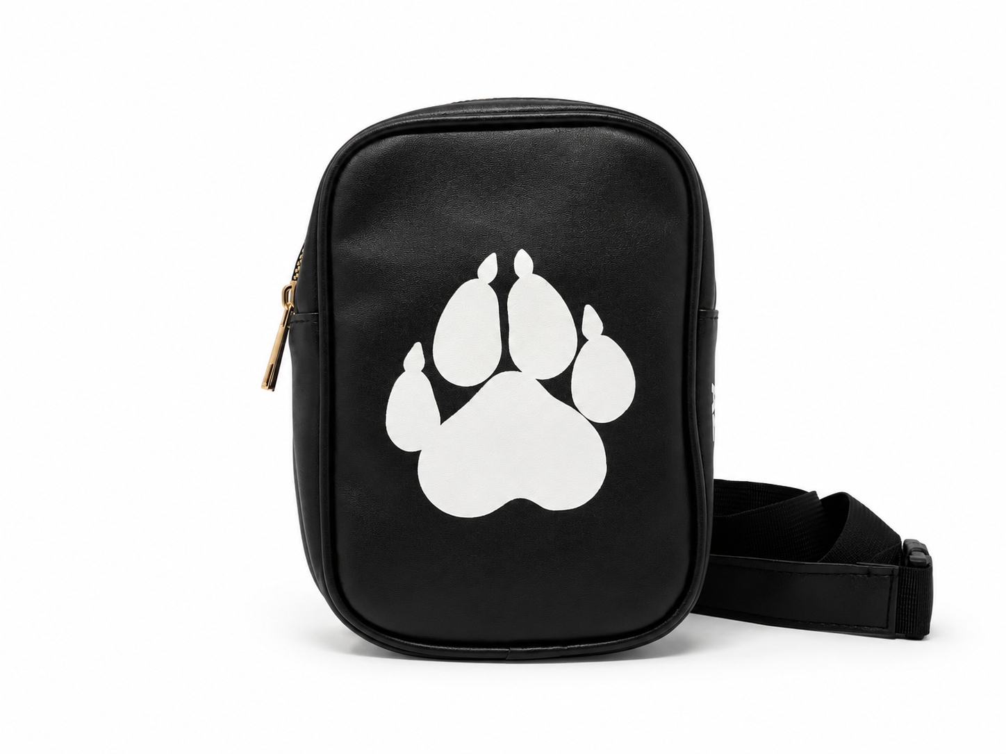 A black crossbody bag featuring a large white paw print graphic on the front, with a gold zipper pull and an adjustable black strap, shown against a plain white background.