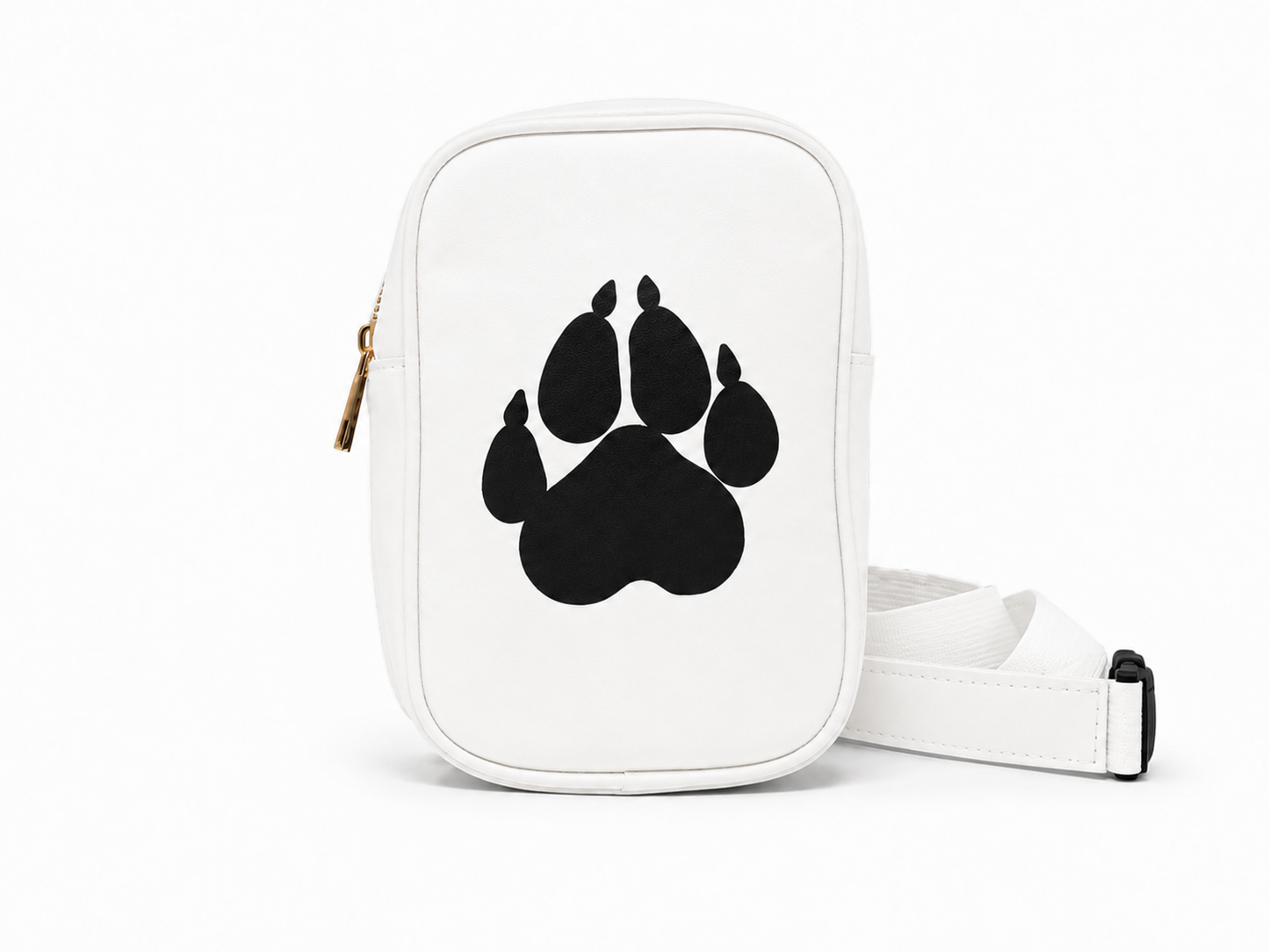 A white crossbody bag with a large black paw print graphic on the front, featuring a gold zipper pull and a white adjustable strap with a black buckle, set against a plain white background.